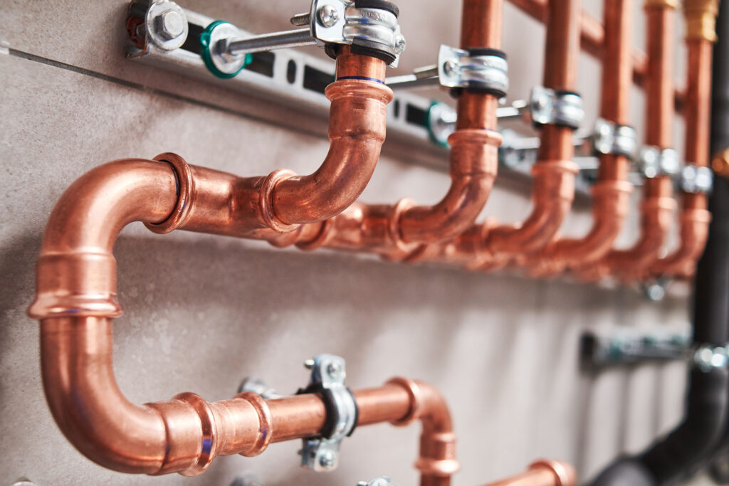 commercial plumbing work done with copper piping in a business