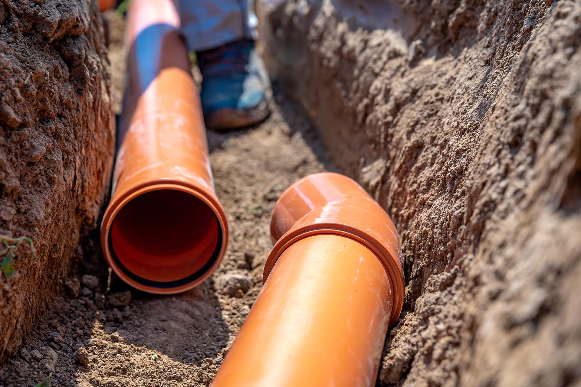 sewer pipes being installed in the ground